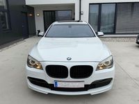 Second-hand BMW 740 Shadowline 306 CP (225 kW) 2011 Alb Berlinǎ