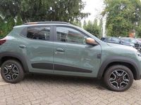 Gebraucht Dacia Spring Extreme 47 kW (65 PS) 2023 Grün "flechtengrau" Kleinwagen