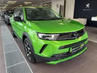 Gebraucht Opel Mokka Elegance 131 PS (96 kW) 2024 Lackierung matcha green/typ au SUV