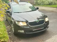 Używany Skoda Superb 125 KM (91 kW) 2013 Czarny Kombi