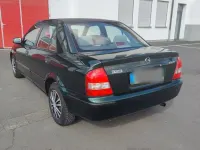 Usata Mazda 323 88 CV (64 kW) 1998 Verde Berlina