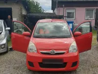 Gebraucht Daihatsu Cuore 69 PS (50 kW) 2008 Rot Kleinwagen