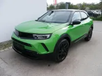 Gebraucht Opel Mokka 131 PS (96 kW) 2022 Matcha grün schwarz dach SUV