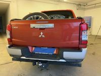 Gebraucht Mitsubishi L200 Top 150 PS (110 kW) 2022 Zirkonorange (metallic) Abholung