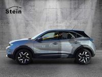 Gebraucht Opel Mokka-e Elegance 100 kW (136 PS) 2022 Kontrast grau/quarz silber (metallic) SUV