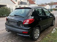 Gebraucht Peugeot 206+ 75 PS (55 kW) 2011 Schwarz Kleinwagen