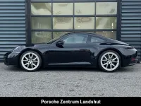 Gebraucht Porsche 911 Carrera 394 PS (289 kW) 2025 Tiefschwarzmetallic Coupé