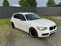 Używany BMW 118 Performance 170 KM (125 kW) 2012 Biały Hatchback