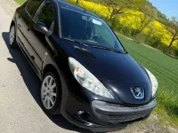 Gebraucht Peugeot 206 73 PS (53 kW) 2010 Schwarz Kleinwagen