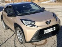Gebraucht Toyota Aygo Pulse 72 PS (52 kW) 2022 Ginger beige (4u9)/ black Kleinwagen