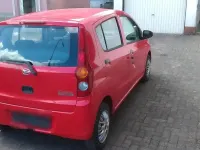 Gebraucht Daihatsu Cuore 69 PS (50 kW) 2007 Rot Kleinwagen