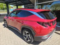 Gebraucht Hyundai Tucson Prime 136 PS (100 kW) 2023 Sunset red / mic SUV
