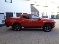 Gebraucht Mitsubishi L200 Top 150 PS (110 kW) 2021 Zirkonorange Pickup
