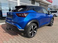 Gebraucht Nissan Juke Tekna 114 PS (83 kW) 2023 Magnetic blue metallic/dach in SUV