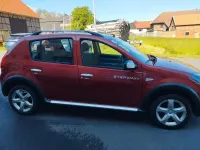Gebraucht Dacia Sandero 88 PS (64 kW) 2012 Rot Kleinwagen