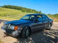 Używany Mercedes E230 132 KM (97 kW) 1990 Purpurowy Sedan/Limuzyna