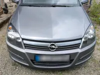 Używany Opel Astra 75 KM (55 kW) 2004 Purpurowy Kombi
