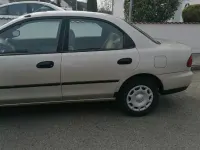 Second-hand Mazda 323 88 CP (64 kW) 1996 Bej Berlinǎ
