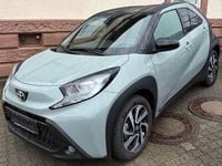 Gebraucht Toyota Aygo X Team 72 PS (52 kW) 2024 Urban khaki (6x3)/ black mica SUV