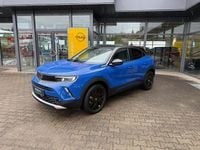 Gebraucht Opel Mokka-e Elegance 100 kW (136 PS) 2023 Kontrast grau/quarz silber SUV