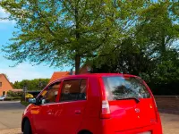 Gebraucht Daihatsu Cuore 58 PS (42 kW) 2006 Rot Kleinwagen