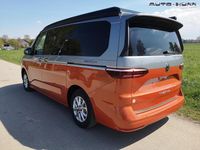 Gebraucht VW T7 Highline 150 PS (110 kW) 2024 Candyweiß / starlightblau metallic dach schwarz Van