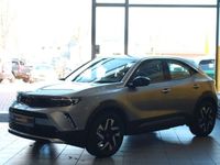 Gebraucht Opel Mokka-e Elegance 100 kW (136 PS) 2023 Kontrast grau/quarz silber SUV