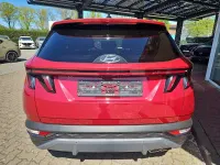 Gebraucht Hyundai Tucson Prime 136 PS (100 kW) 2023 Sunset red / mic SUV