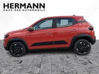 Gebraucht Dacia Spring Extreme 47 kW (65 PS) 2025 Brick red (rot) Kleinwagen