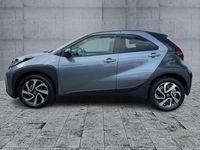 Gebraucht Toyota Aygo X 72 PS (52 kW) 2025 Celestite grey (1k3)/ black mi SUV