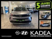 Gebraucht Opel Mokka Elegance 131 PS (96 kW) 2022 Kontrast grau/quarz silber SUV