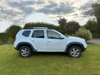 Używany Dacia Duster Prestige 105 KM (77 kW) 2011 Biały SUV