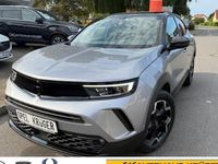 Gebraucht Opel Mokka Ultimate 131 PS (96 kW) 2023 Kontrast grau/quarz silber (metallic) SUV