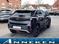 Gebraucht Opel Mokka-e Ultimate 100 kW (136 PS) 2023 Diamant schwarz/karbon schwarz SUV