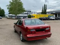 Gebraucht Nissan Almera 75 PS (55 kW) 1997 Rot Kleinwagen