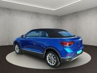 Gebraucht VW T-Roc Cabriolet Style 150 PS (110 kW) 2024 Ravennablau metallic/schwarz Cabrio