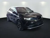 Gebraucht Opel Mokka-e Elegance 100 kW (136 PS) 2022 Diamant schwarz/karbon schwarz (metallic) SUV