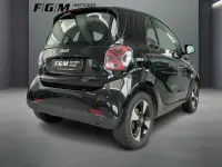 Gebraucht Smart ForTwo Coupé 60 kW (82 PS) 2023 Bodypanels in black Kleinwagen