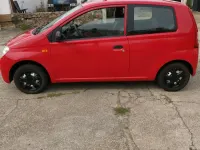 Gebraucht Daihatsu Cuore 58 PS (42 kW) 2004 Rot Kleinwagen