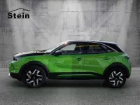 Gebraucht Opel Mokka-e Elegance 100 kW (136 PS) 2022 Matcha green/ikone gruen (metallic) SUV