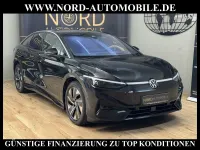 Gebraucht VW ID.7 Pro 210 kW (286 PS) 2023 Grenadillschwarz met (metallic) Kleinwagen