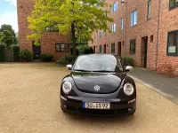Gebraucht VW New Beetle 102 PS (75 kW) 2010 Schwarz Kleinwagen
