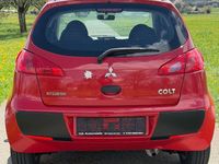 Second-hand Mitsubishi Colt Inform 75 CP (55 kW) 2008 Roșu Berlinǎ