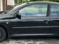 Używany Peugeot 206 75 KM (55 kW) 2009 Czarny Sedan/Limuzyna