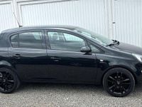 Używany Opel Corsa Active 87 KM (63 kW) 2013 Czarny Hatchback