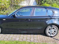 Second-hand BMW 116 122 CP (89 kW) 2011 Negru Hatchback