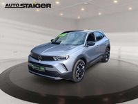 Gebraucht Opel Mokka Ultimate 131 PS (96 kW) 2023 Kontrast grau/quarz silber SUV