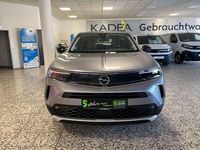 Gebraucht Opel Mokka Elegance 131 PS (96 kW) 2022 Kontrast grau/quarz silber SUV