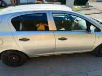 Używany Opel Corsa 75 KM (55 kW) 2010 Srebrny Hatchback