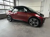 Gebraucht BMW i3 Performance 183 kW (250 PS) 2022 Aventurinrot m.akz. frozen gre Kleinwagen